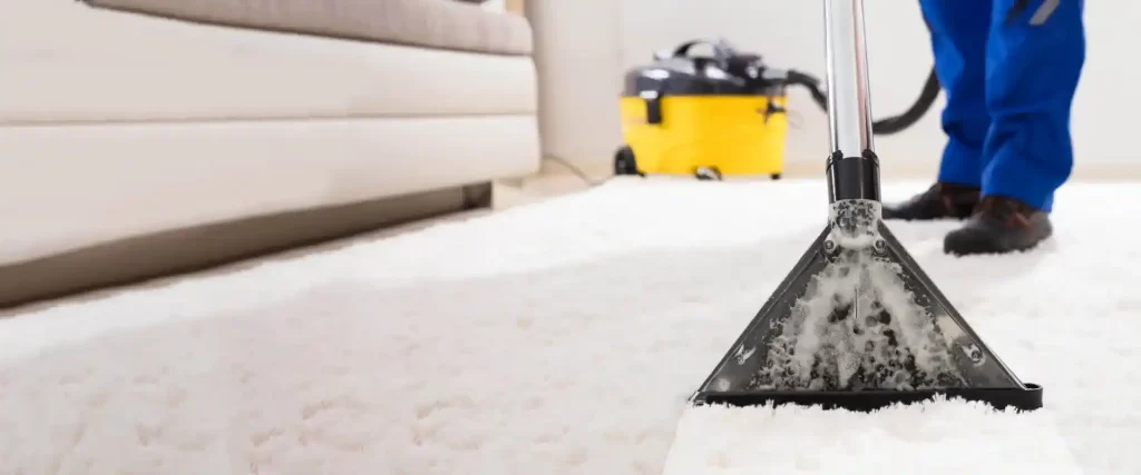 Green Choice technician cleaning a carpet
